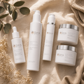 Brightening Radiance Ritual System bundle - 5 products on tan linen blanket